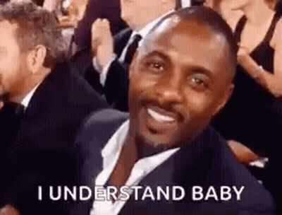 Man In Suit Smiling In Crowd GIF