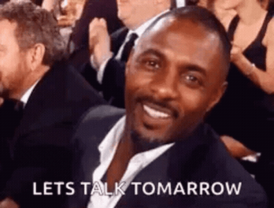 Man In Suit Smiling In Crowd GIF