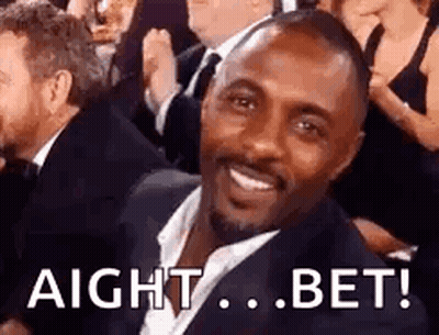 Man In Suit Smiling In Crowd GIF
