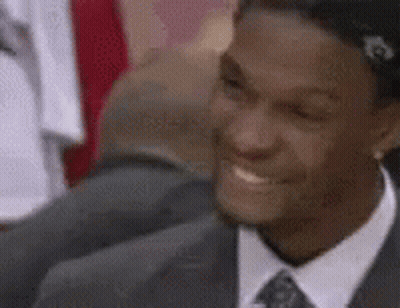 Man In Suit Smiling In Crowd GIF
