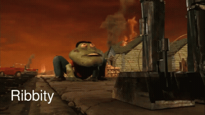 Man In Suit Smiling In Front Of Bookshelf GIF