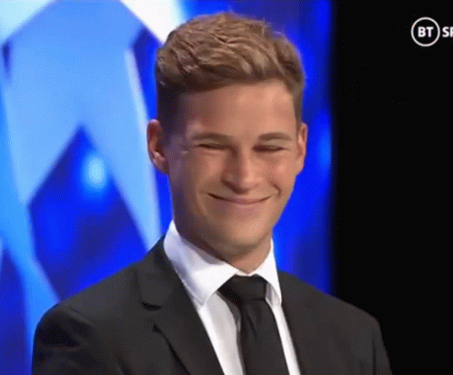Man In Suit Smiling In Front Of BT Ad GIF