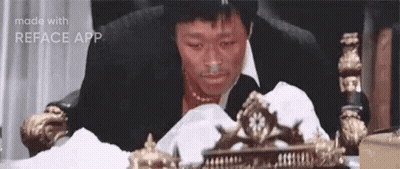 Man In Suit Smiling In Front Of Stanley Cup Banner GIF