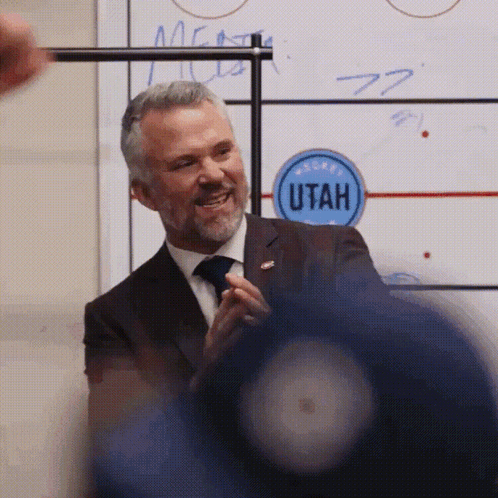 Man In Suit Smiling In Front Of Utah Whiteboard GIF