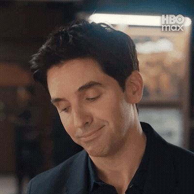 Man In Suit Smiling Looking Down GIF