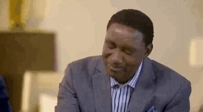 Man In Suit Smiling Looking Down GIF