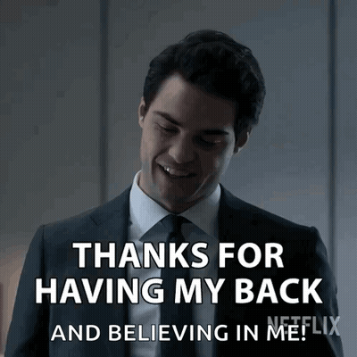 Man In Suit Smiling Saying Thanks For Having My Back GIF