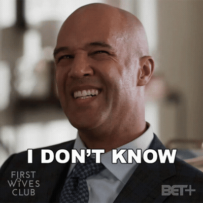 Man In Suit Smiling Says I Don't Know GIF