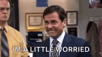 Man In Suit Smiling Says Im A Little Worried GIF