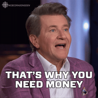 Man In Suit Smiling Says We Need Money GIF