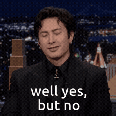 Man In Suit Smiling Says Well Yes But No GIF