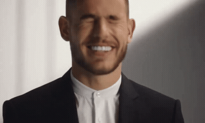 Man In Suit Smiling With Eyes Closed GIF