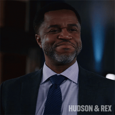 Man In Suit Smiling With Hudson & Rex GIF