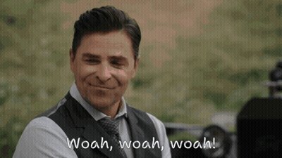 Man In Suit Smiling With Woah Woah Woah GIF