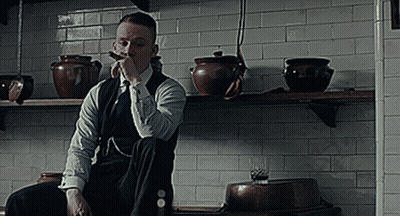 Man In Suit Smoking Cigar In Kitchen GIF