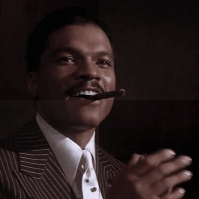 Man In Suit Smoking Cigar GIF