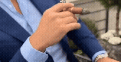 Man In Suit Smoking Cigar With Watch GIF