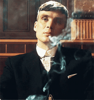 Man In Suit Smoking Cigarette GIF