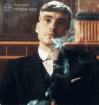 Man In Suit Smoking Cigarette GIF