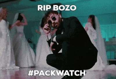 Man In Suit Smoking Cigarette At Microphone Saying Rip Bozo GIF