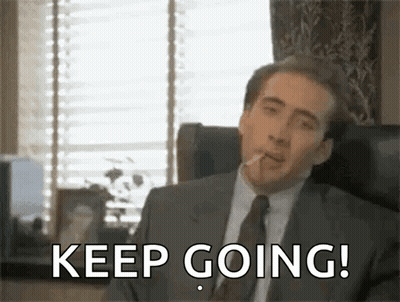 Man In Suit Smoking Cigarette GIF