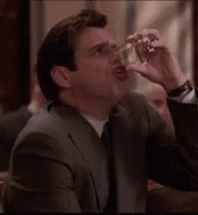 Man In Suit Smoking Cigarette GIF