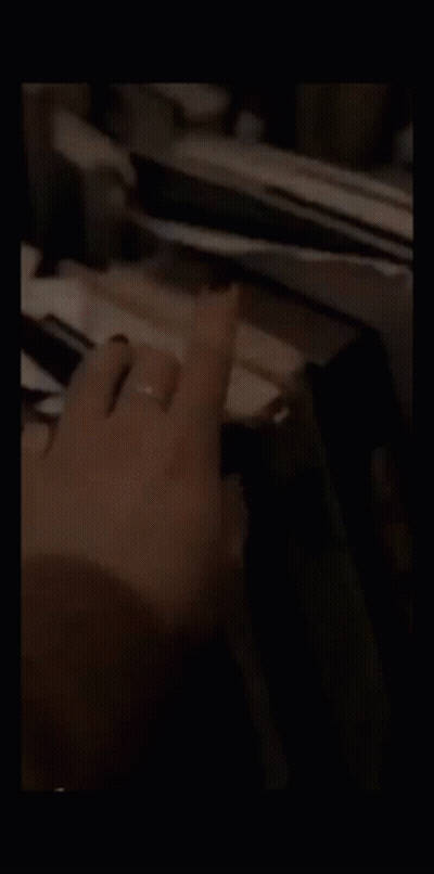 Man In Suit Smoking Cigarette Next To Another Man GIF