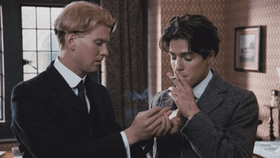 Man In Suit Smoking Cigarette Next To Another Man GIF