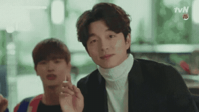 Man In Suit Smoking Cigarette While Another Watches GIF