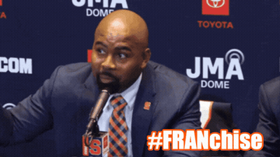 Man In Suit Speaking At JMA Dome GIF