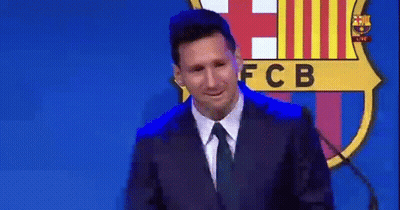 Man In Suit Speaking At Microphone With FCB Logo GIF