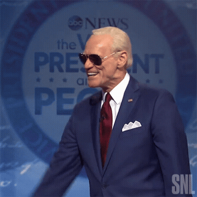 Man In Suit Speaking Into Mic With SNL GIF