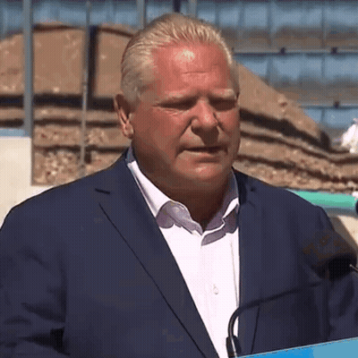 Man In Suit Speaking Into Microphone GIF