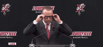 Man In Suit Speaking Into Microphone GIF