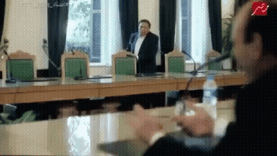 Man In Suit Speaking Into Microphone GIF