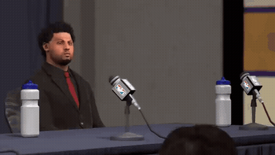 Man In Suit Speaking Into Microphone GIF