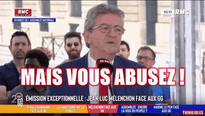 Man In Suit Speaking Into Microphone Mais Vous Abusez GIF