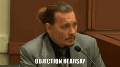 Man In Suit Speaking Into Microphone Objection Hearsay GIF