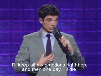 Man In Suit Speaking Into Microphone Saying I'll Keep All My Emotions GIF