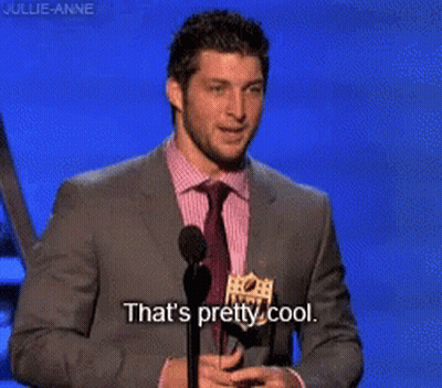 Man In Suit Speaking Into Microphone Saying That's Pretty Cool GIF