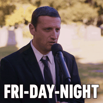 Man In Suit Speaking Into Microphone With Fri-Day-Night GIF