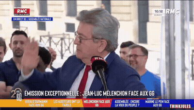 Man In Suit Speaking Into RMC Microphone GIF