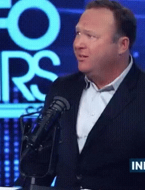 Man In Suit Speaking Microphone At Fox Screen GIF