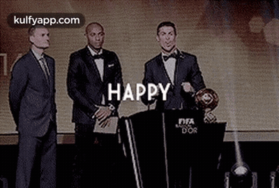 Man In Suit Speaking Podium Two Men Behind GIF