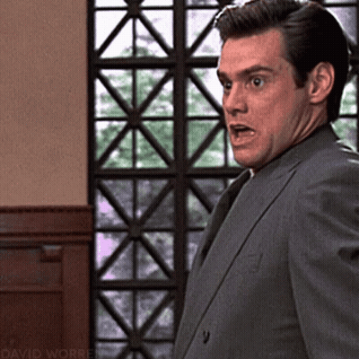 Man In Suit Standing At Window With David Worren GIF