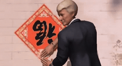Man In Suit Standing Before Chinese Symbol GIF