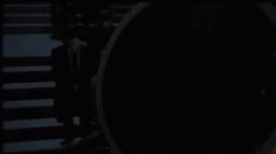 Man In Suit Standing Before CS GO Sign GIF