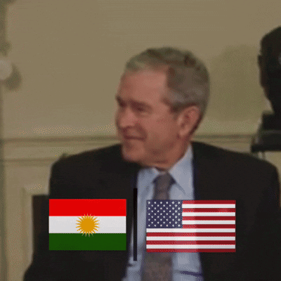 Man In Suit Standing Before Flags GIF
