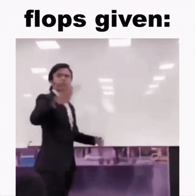 Man In Suit Standing Before Flops Given GIF