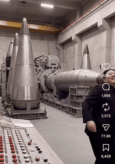 Man In Suit Standing Before Missiles GIF